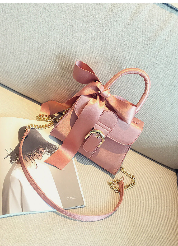 Bow diagonal handbag