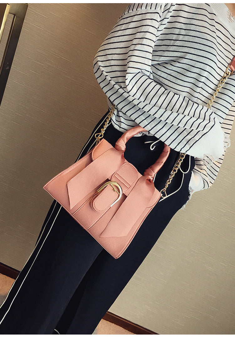 Bow diagonal handbag